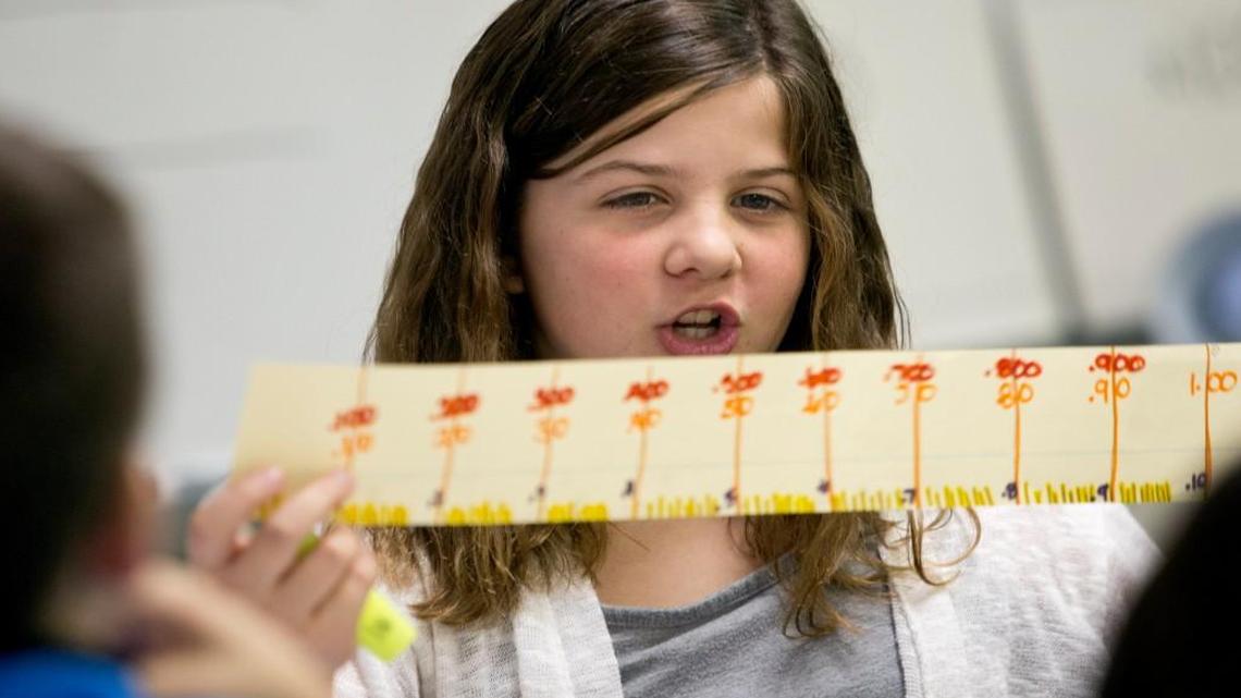 Jenna Darby uses her number line to share her views on a math problem in Dana Snapp's class at Fuquay-Varina Elementary School. Students there have been using Common Core Math for the past four years. School administrators say it is working for both the students and teachers, while some parents are looking to get rid of it. Rene Herrick, teacher leadership specialist in mathematics at the school, not seen, says the system is important to keep in place.