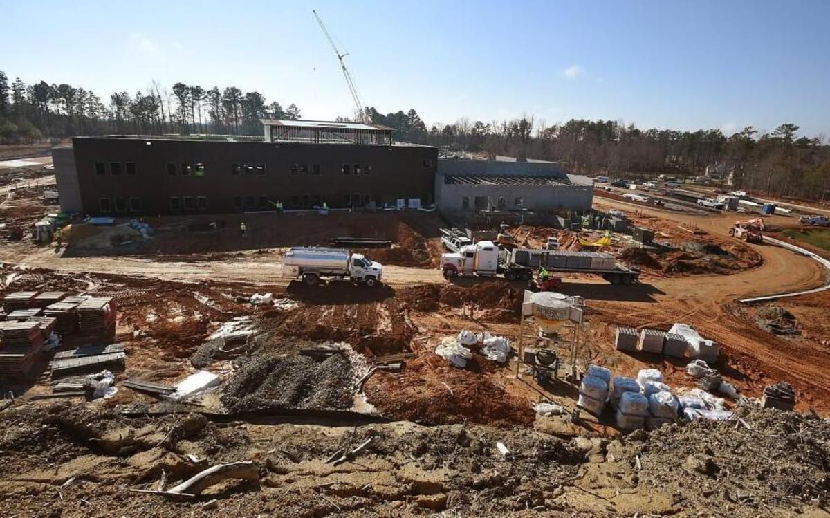 The worksite at the new Oakview Elementary School is full of activity as construction continues Dec. 8, 2015 in Holly Springs, N.C. A bill passed by the state House would have the state DOT reimburse schools when they’re required to make street improvements by municipalities as part of construction projects.