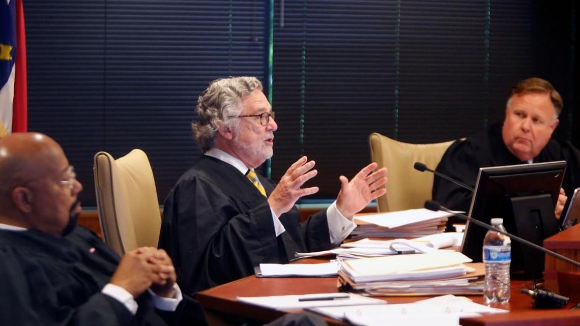 A three-judge panel of L. Todd Burke, left, Jesse Caldwell, center, and Jeffrey Foster hear arguments in one of the lawsuits filed by Gov. Roy Cooper challenging the second rendition of the elections board-ethics commission revamp. The hearing was held at Campbell Law school on June 1, 2017.