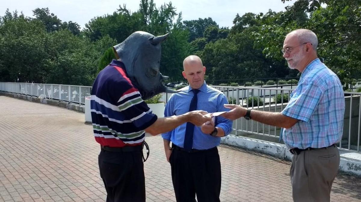 A demonstrator in a rhinoceros mask participates in a Grass Roots North Carolina rally outside the NC General Assembly on Thursday, Aug. 3, 2017, calling on N.C. Senate Republicans to pass legislation loosening gun permit requirements. General Assembly police told the demonstrator to remove the mask.