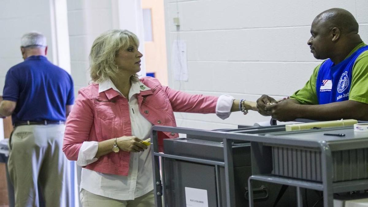 U.S. Rep. Renee Ellmers thanks poll worker Reggie McNeill after she casts her primary-election ballot Tuesday, June 7, 2016 at Wayne Avenue Elementary in Dunn.