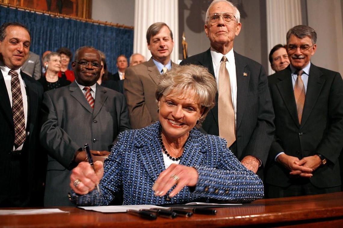 NC Governor Beverly Perdue, the first woman governor, signs into law a bill that prohibits smoking in bars and restaurants, at the Old House Chamber in the State Capitol on May 19, 2009.