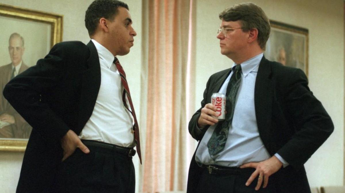 In this 1995 file photo, Mark Bibbs, left, talks to Joe Stallings at a UNC Board of Governors meeting.