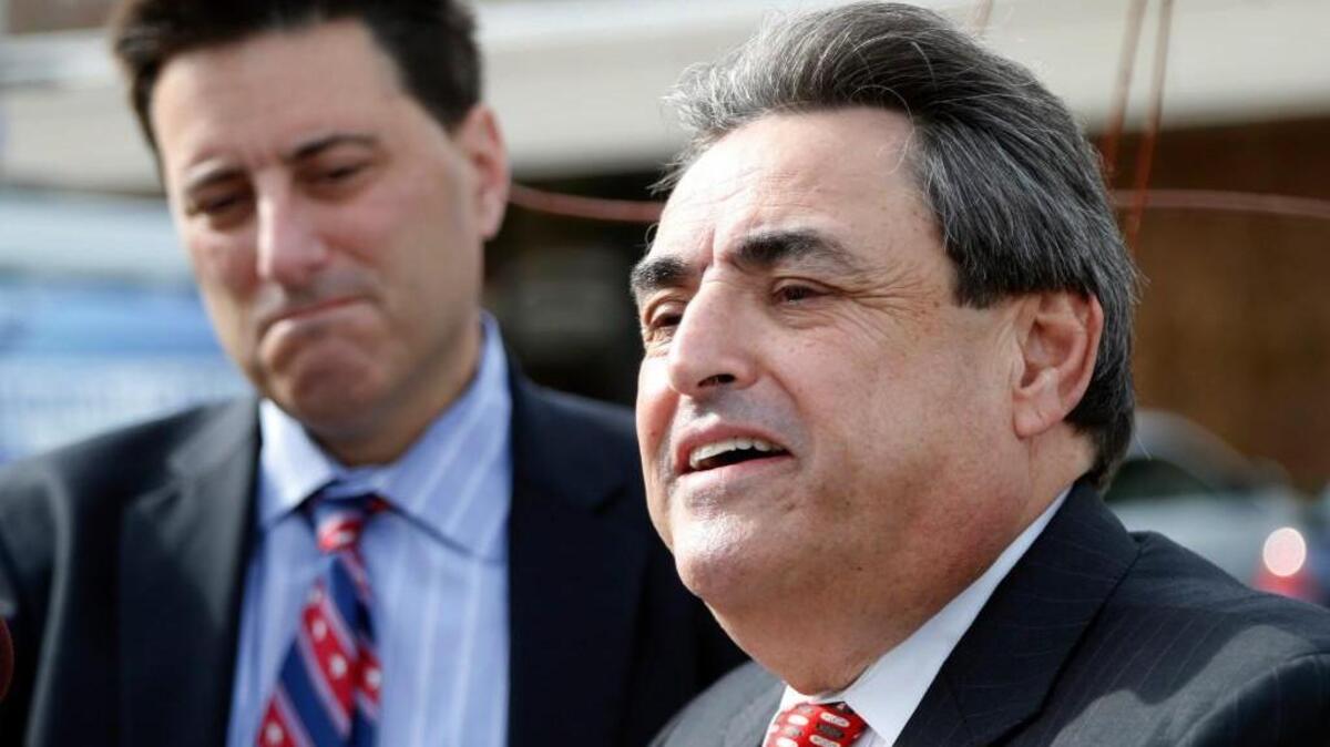 Then-state Sen. Bob Rucho, right, a Republican, holds a press conference outside the N.C. Board of Elections building in Raleigh along with Dallas Woodhouse, executive director of the N.C. Republican Party, on Nov. 30, 2016.