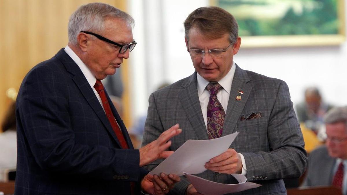 Rep. Mike Hager, right, is resigning from the state House.