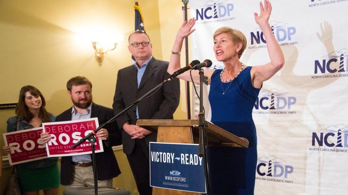 Democratic US Senate nominee Deborah Ross thanks supporters as her husband Steve Wrinn looks on as she makes her primary election victory speech during a primary election night party Tuesday, March 15, 2016 at the North Carolina Democratic Party headquarters in Raleigh.