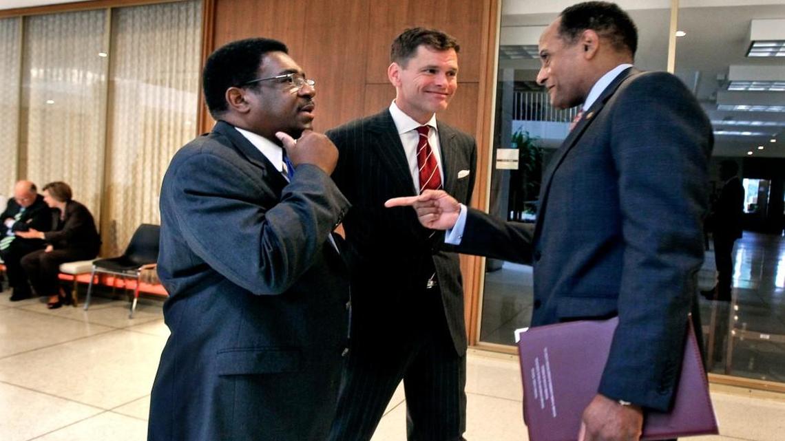 Democratic Representatives (from left) Garland Pierce, Grier Martin and Larry Hall huddle in the hallway of the N.C. General Assembly after holding a press conference on July 15, 2014. Martin is overseeing races for the House Democratic caucus and thinks the Democrats have a chance to pick up several seats.