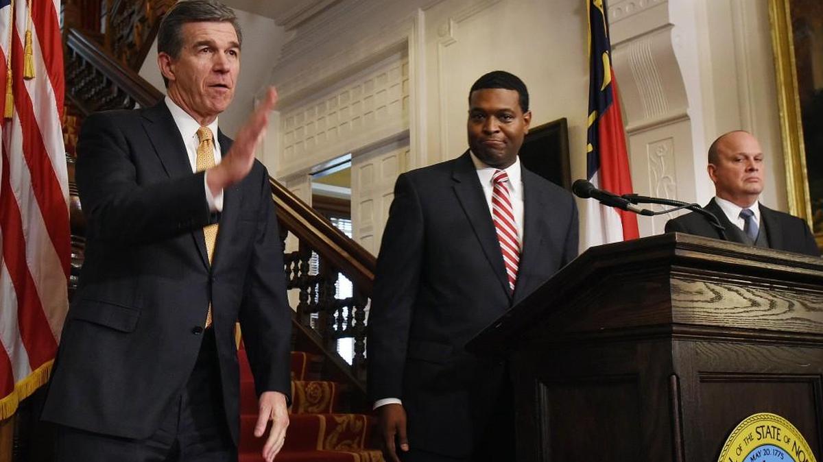 Gov. Roy Cooper (left) ends a press conference where he named two new Cabinet secretaries to run his new administration. The new Democratic governor announced James Trogdon (right) as secretary of the Department of Transportation and Michael Regan (center) to lead the Department of Environmental Quality. The announcement was made at the Executive Manson in Raleigh on Tuesday, Jan. 3, 2017.