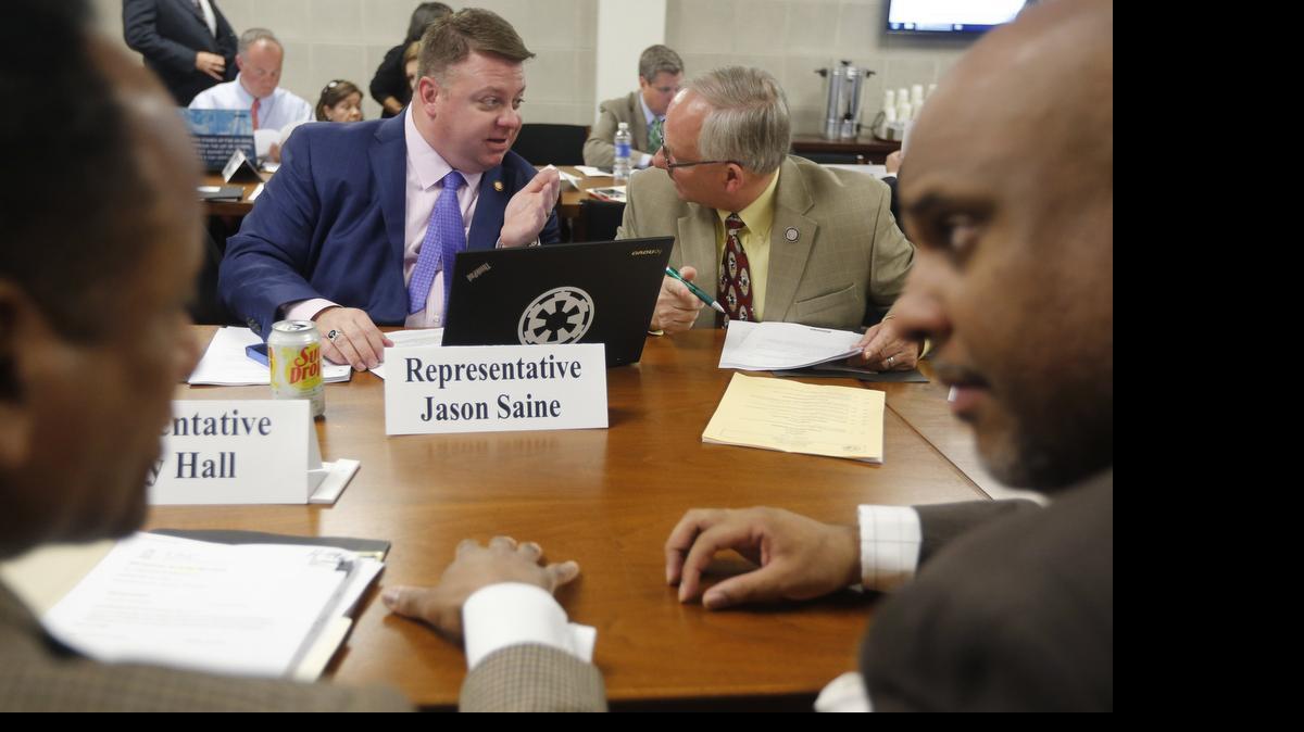 
Rep. Jason Saine, left, talks with Rep. James Boles at the legislature. Saine has led hearings on the Senate budget.
