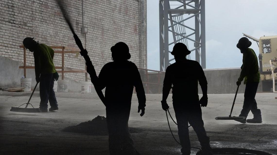 This News & Observer file photo shows a worker spraying concrete onto the ceiling of the parking garage of the former Jack Tar Motel in Durham on August 3, 2016.