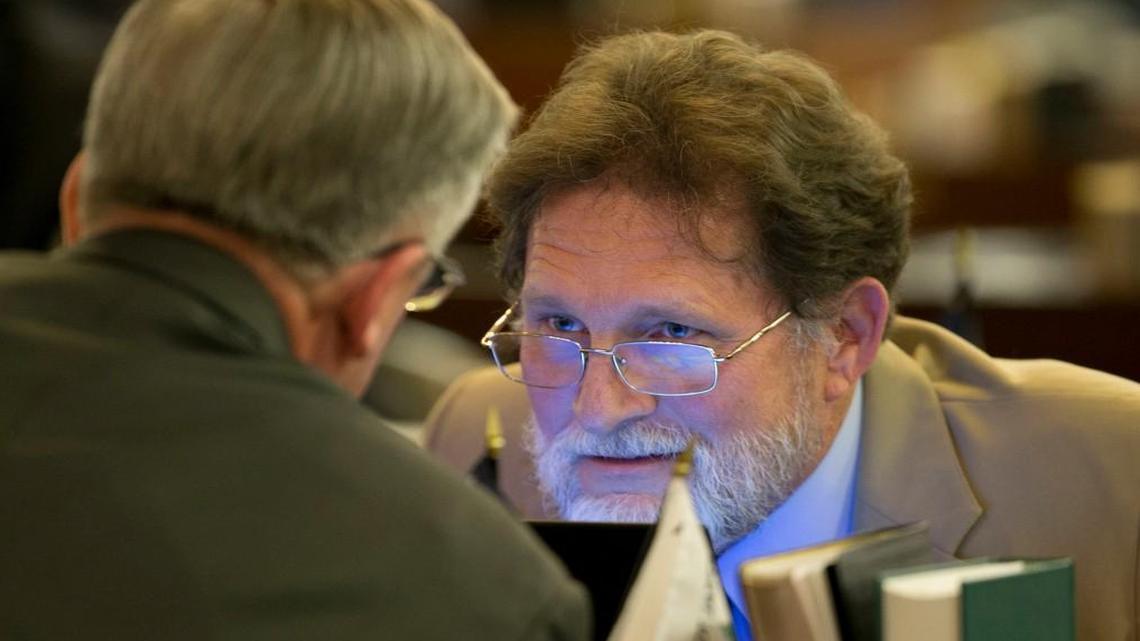 Rep. Larry Pittman of Concord, N.C. talks with Rep. Bob Steinburg of Edenton, N.C. during the evening session of the North Carolina House of Representatives in Raleigh, N.C. on Monday April 25, 2016.