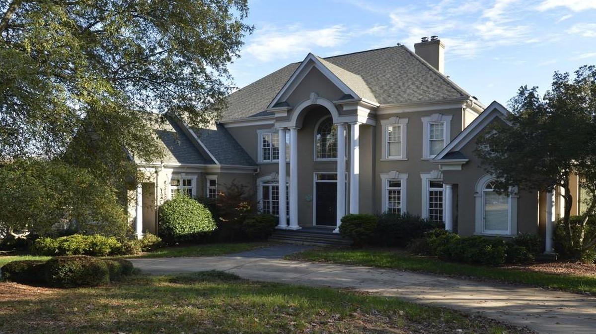8417 Kelly Woods Lane in Charlotte's Piper Glen neighborhood off Rea Road, where squatters took up residence after a foreclosure.