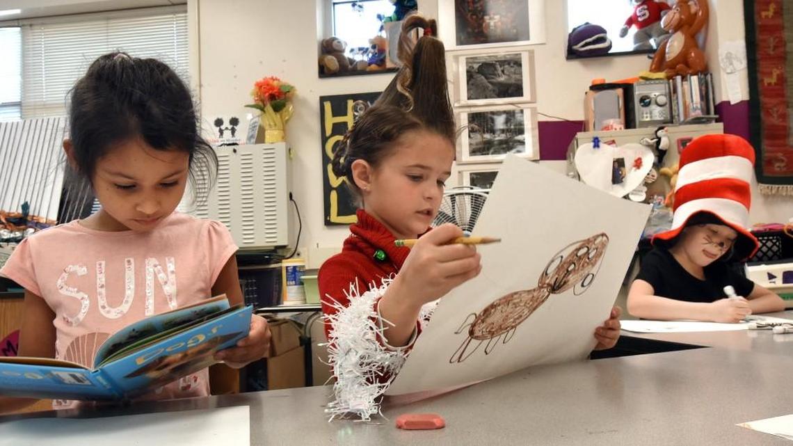 First graders (left to right) Vanessa Mendez-Moreno, Lilah Morgan and Blake Ward work on art projects in Jennifer McIntyre’s art class at Timber Drive Elementary School in Garner March 2, 2017.