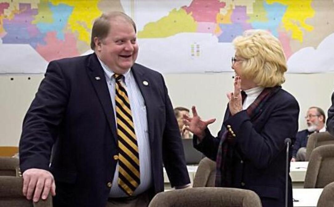 Members of the Joint Select Committee on Congressional Redistricting meet before the start of their morning meeting at the N.C. Legislature in front of historical districting maps on Tuesday, February 16, 2016.