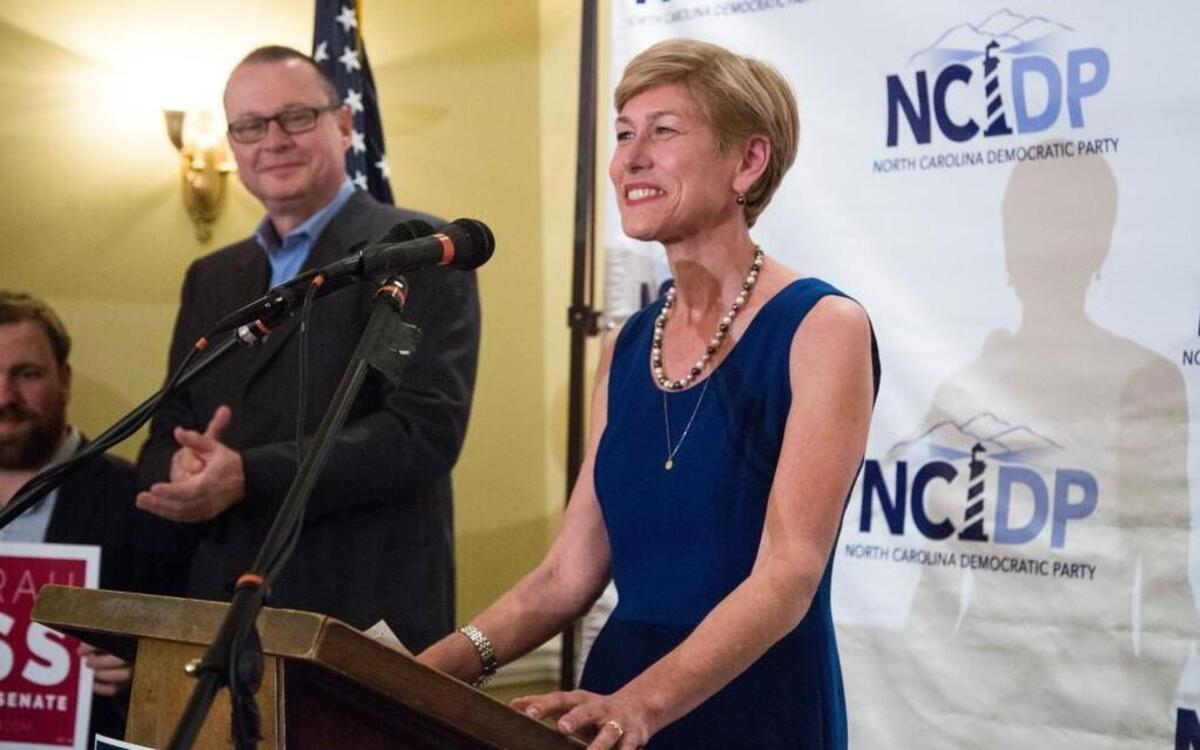 Democratic US Senate nominee Deborah Ross thanks supporters as her husband Steve Wrinn looks on as she makes her primary election victory speech during a primary election night party Tuesday, March 15, 2016 at the North Carolina Democratic Party headquarters in Raleigh.