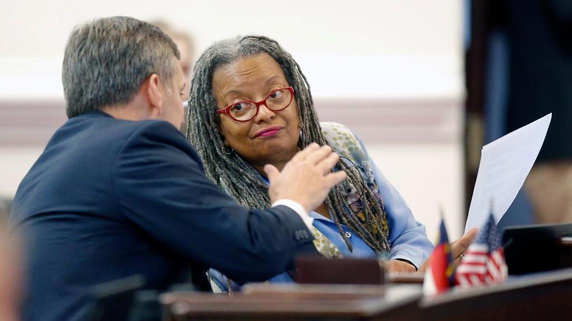 Sen. Angela Bryant confers with then-state Sen. Josh Stein on the floor in the Senate chambers in Raleigh in 2015.  Bryant resigned her seat over the weekend and was appointed to the state's Post-Release Supervision and Parole Commission on Monday.