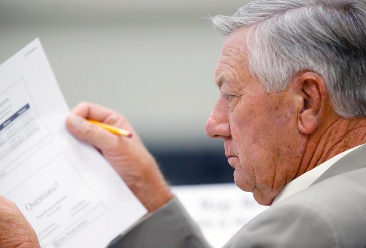 Rep. William Brisson reads over some material during a House committee meeting in Raleigh on July 29, 2015.