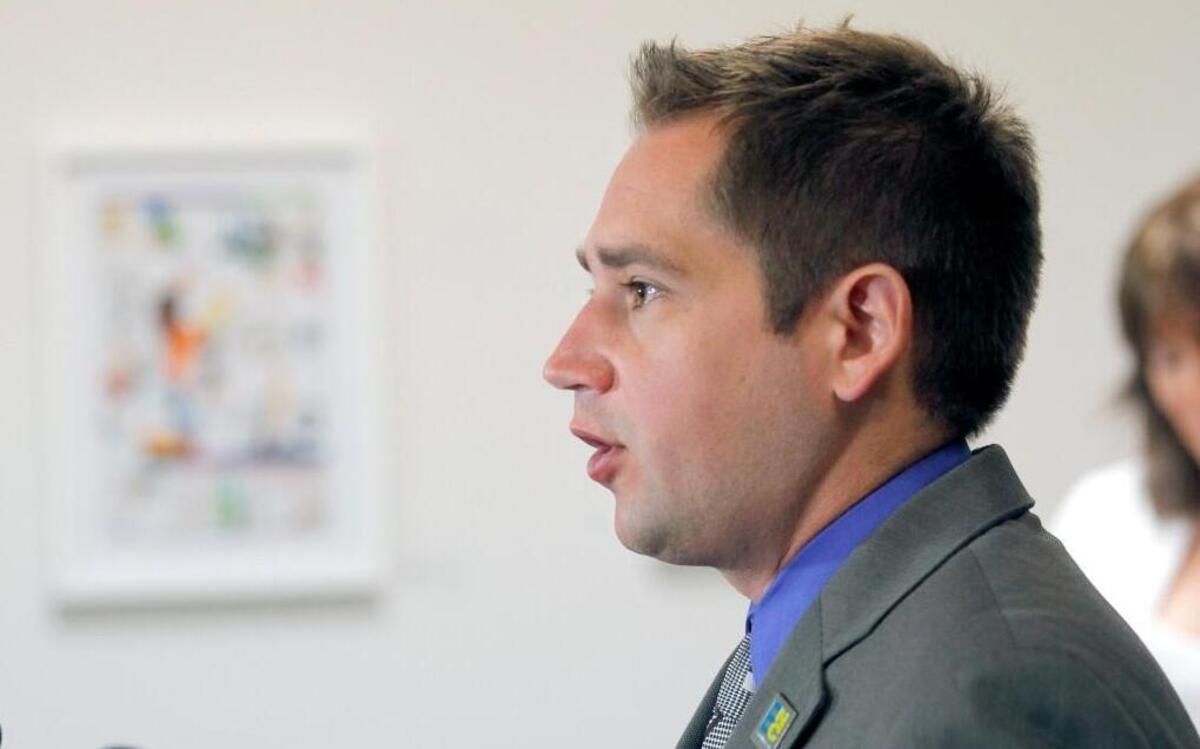 Chris Sgro, executive director of Equality NC, speaks during a press conference to announce filing of federal lawsuit challenging North Carolina's HB 2 law at the LGBT Center of Raleigh on Monday, March 28, 2016.