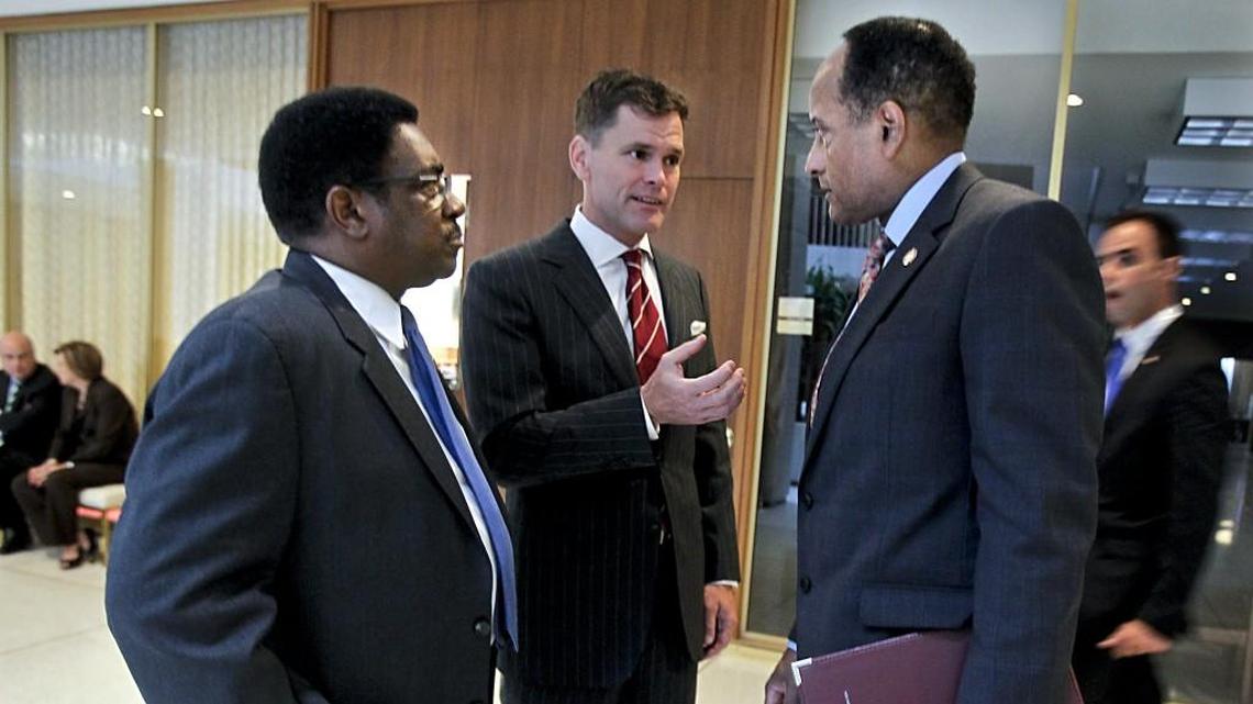 In this 2014 file photo, Democratic House members (from left) Garland Pierce, Grier Martin and Larry Hall huddle in the hallway of the N.C. General Assembly.
