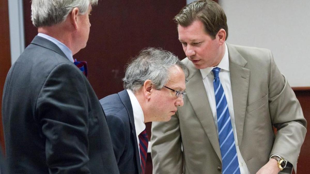 Thomas Farr, center, conferring with attorneys during a break at a hearing to determine whether the Voter ID law requires a change to the N.C. Constitution.