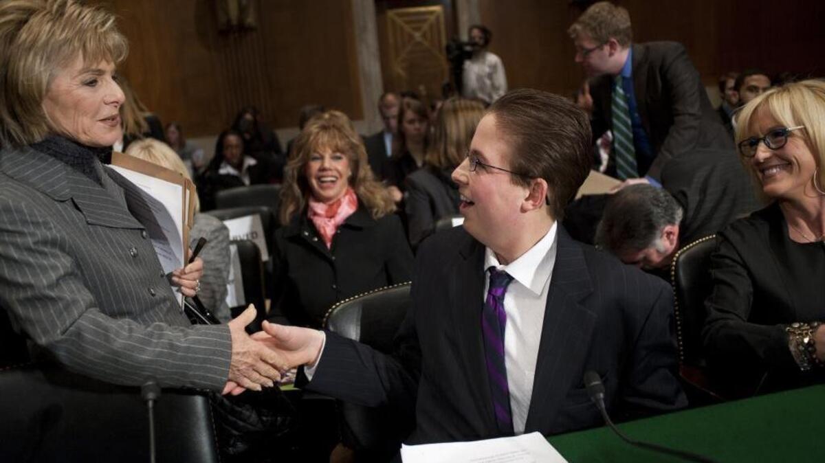 Sen. Barbara Boxer, D-Calif., greeted Trevor Schaefer and Erin Brockovich, president of Brockovich Research & Consulting, before they testified during an Environment and Public Works Committee hearing on "Disease Clusters and Environmental Health" in 2011.