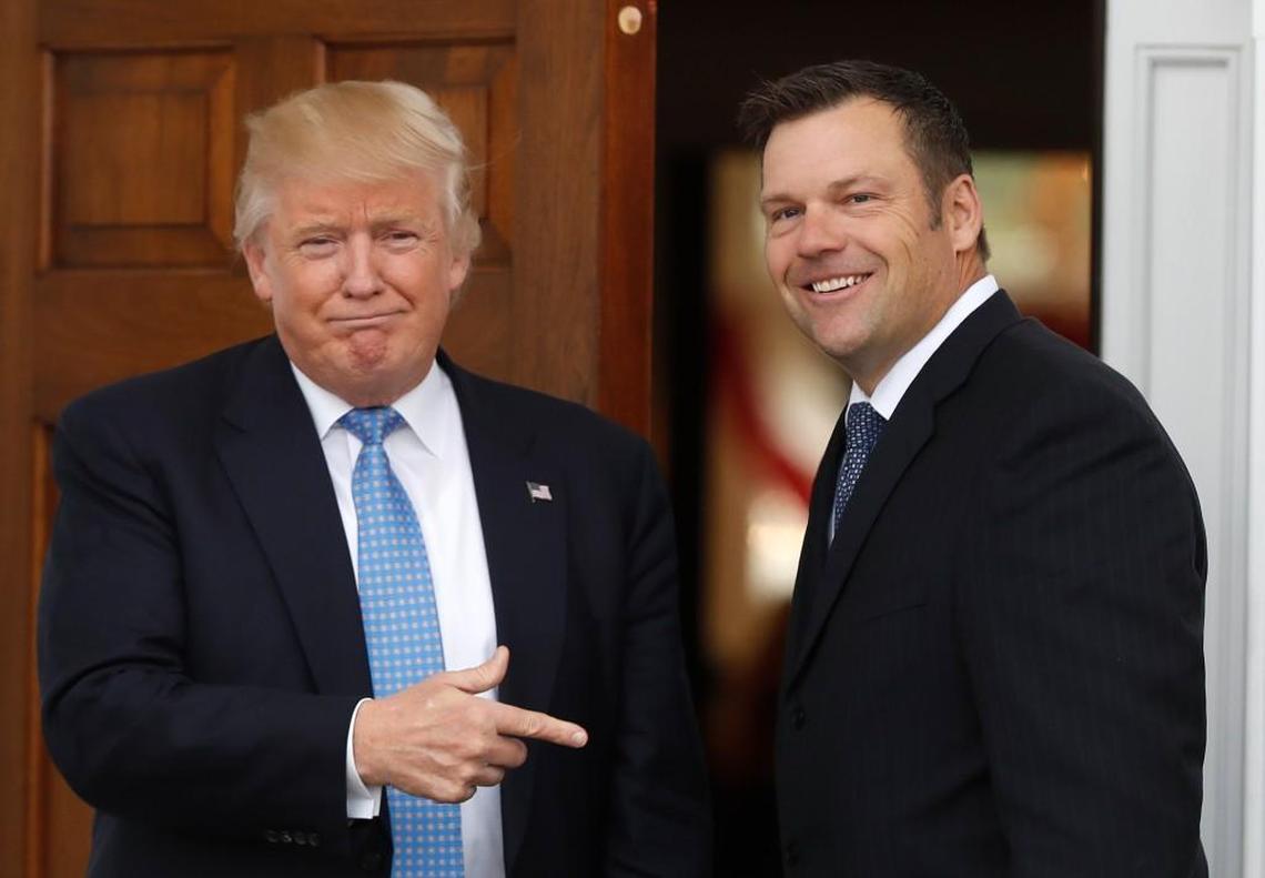 President-elect Donald Trump greets Kansas Secretary of State Kris Kobach as he arrives at the Trump National Golf Club Bedminster clubhouse on Nov. 20, 2016, in Bedminster, N.J. Kobach is vice-chairman of the Presidential Advisory Commission on Election Integrity.