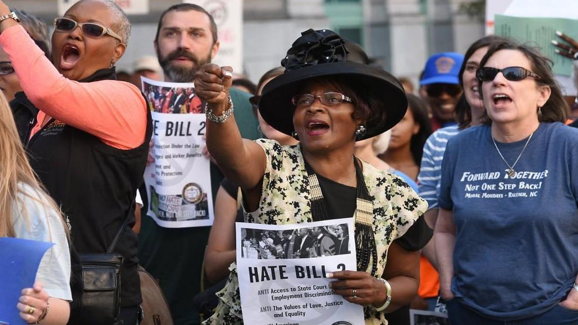 HB2 protesters cheer after a speech at the Bicentennial Mall as members of the Moral Monday rally across the street from the legislative building Monday, May 16, 2016. The law is becoming a key issue in Wake legislative races.