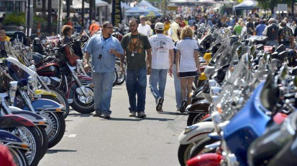 At the 2012 Capital City Bikefest in downtown Raleigh, spectators make their way through rows of hundreds of motorcycles on Fayetteville Street.