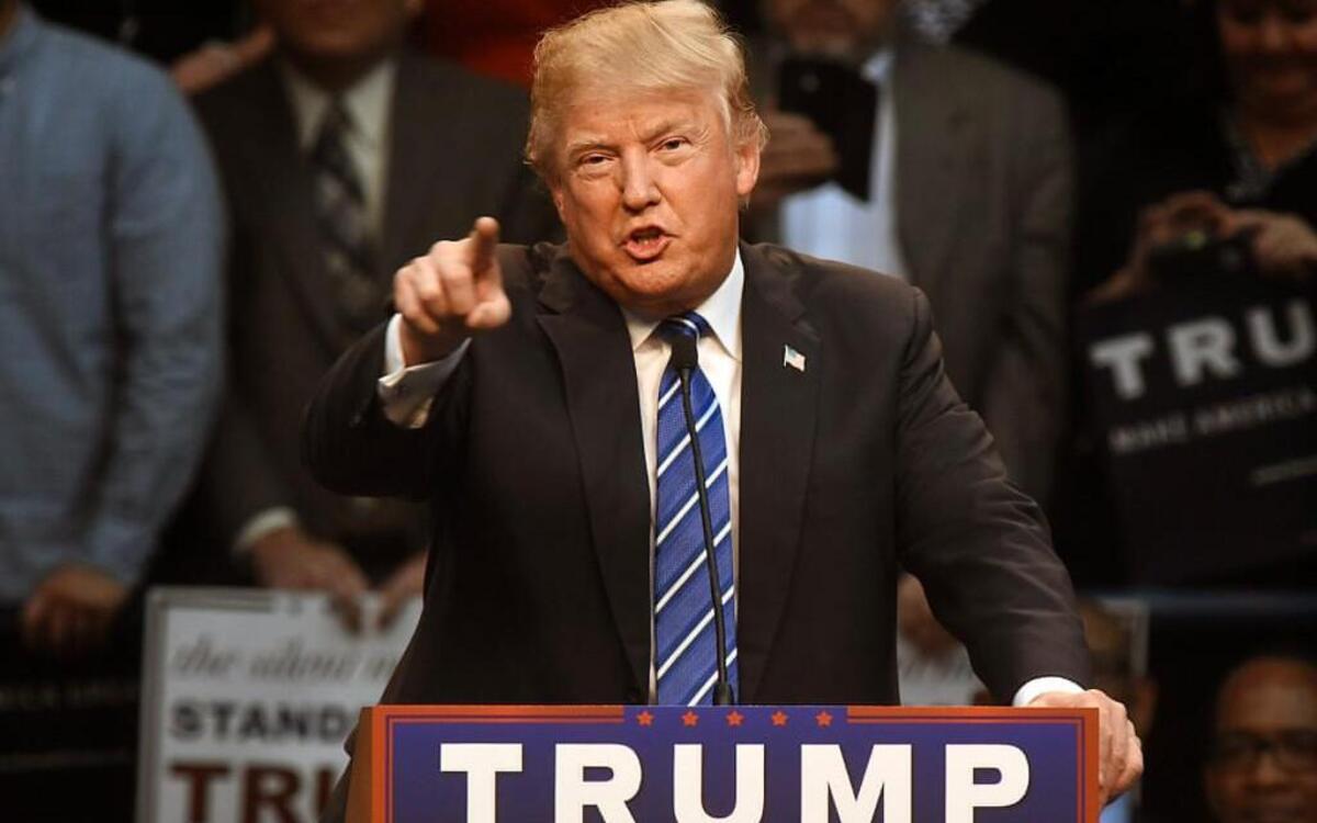 Republican presidential candidate Donald Trump points to the media and calls them "Liars" as he speaks to supporters at Dorton Arena in Raleigh, N.C. Friday, December 4, 2015.
