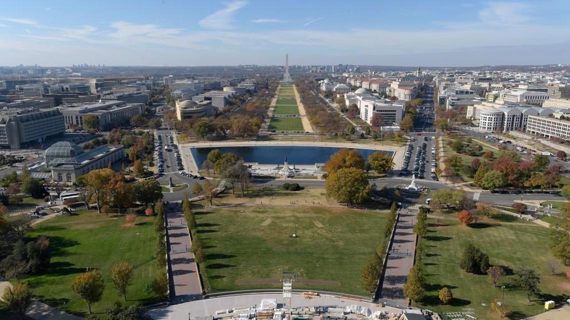 In this Nov. 15, 2016 photo, inaugural preparations continue on the West Front of Capitol Hill in Washington, looking at the National Mall and Washington Monument. One thing you can count on during inauguration season in Washington: People of all stripes will find a reason to show up, whether it’s to celebrate or commiserate.