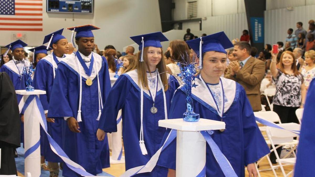 
Graduates process through the gym at Neuse Charter School in Johnston County. The N.C. House budget would give $1 million to a private advocacy group to fund start-up costs at rural charter schools.
