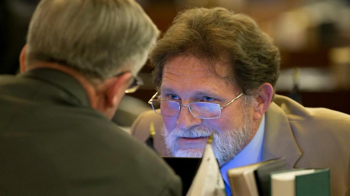 Rep. Larry Pittman of Concord, N.C. talks with Rep. Bob Steinburg of Edenton, N.C. during the evening session of the North Carolina House of Representatives in Raleigh, N.C. on Monday April 25, 2016.
