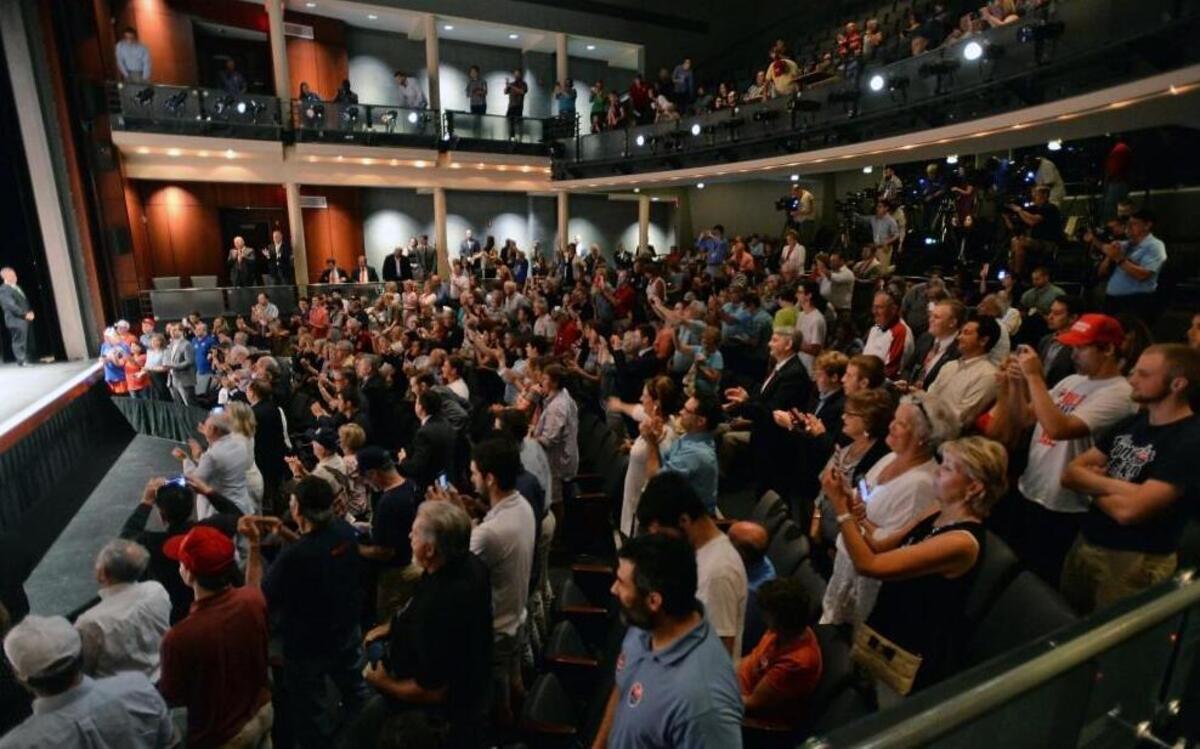 The audience cheers for Mike Pence, Republican candidate for Vice-President , as he finished remarks to about 350 people during a town hall meeting at the Fletcher Opera Theater at the Duke Energy Center for the Performing Arts in Raleigh, N.C. Thursday, August 4, 2016.