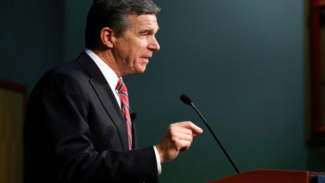 Roy Cooper speaks during a press conference at PNC Arena in December.