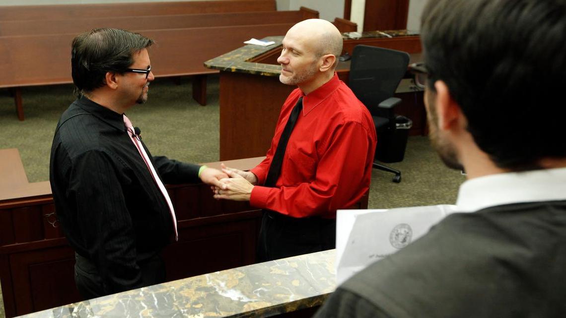 
Same sex couple Craig Johnson, left, and Shawn Long, center, are married by Magistrate Jacob Davis, right, in downtown Raleigh in October. The N.C. House will vote soon on whether to override Gov. Pat McCrory’s veto and allow magistrates to opt out of performing marriage if they have a religious objection.
