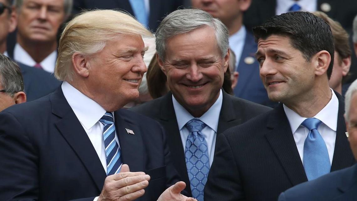 President Donald Trump stands with House Speaker Paul Ryan, right, and Freedom Caucus Chairman Mark Meadows, center, during an event May 4, 2017, in the White House Rose Garden after Republicans passed legislation aimed at repealing and replacing Obamacare.