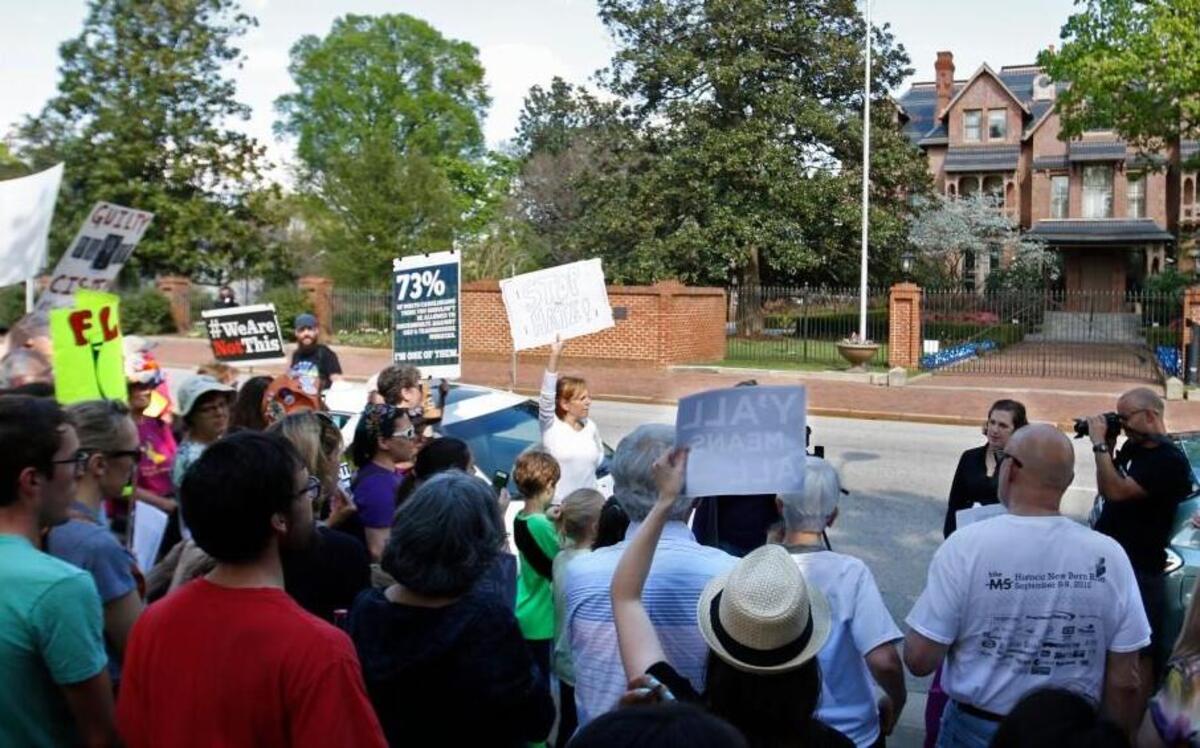 A protest crowd of about two hundred gathered across from the NC Governor's Mansion, right, on North Blount Street as Triangle Families Against HB2 loudly shouted and chanted slogans and sang songs noting their distaste for HB2, the Republican led Legislature and particularly NC Governor Pat McCrory Saturday afternoon, April 2, 2016.