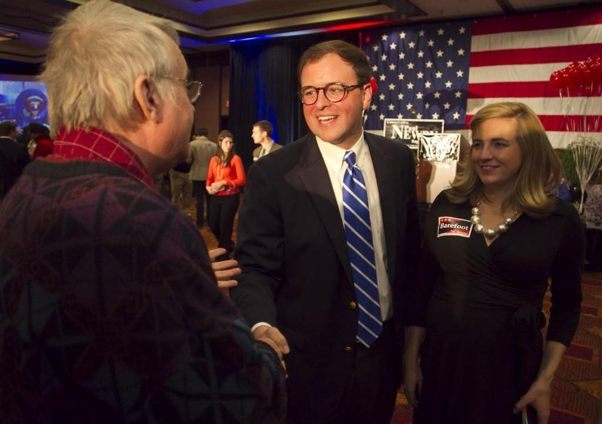 Republican Chad Barefoot (center) shakes hands with supporters at the North Raleigh Hilton on Nov. 6, 2012, after being elected to the North Carolina state Senate from District 18.