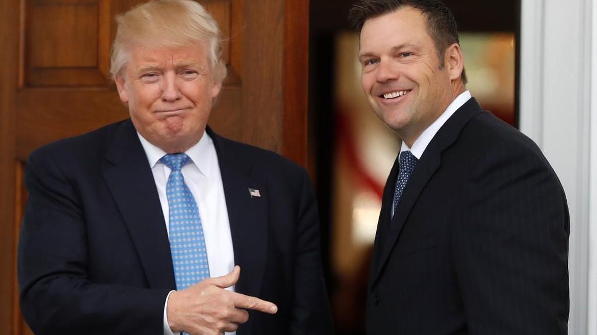 President-elect Donald Trump greets Kansas Secretary of State, Kris Kobach, as he arrive at the Trump National Golf Club Bedminster clubhouse, Sunday, Nov. 20, 2016, in Bedminster, N.J.
