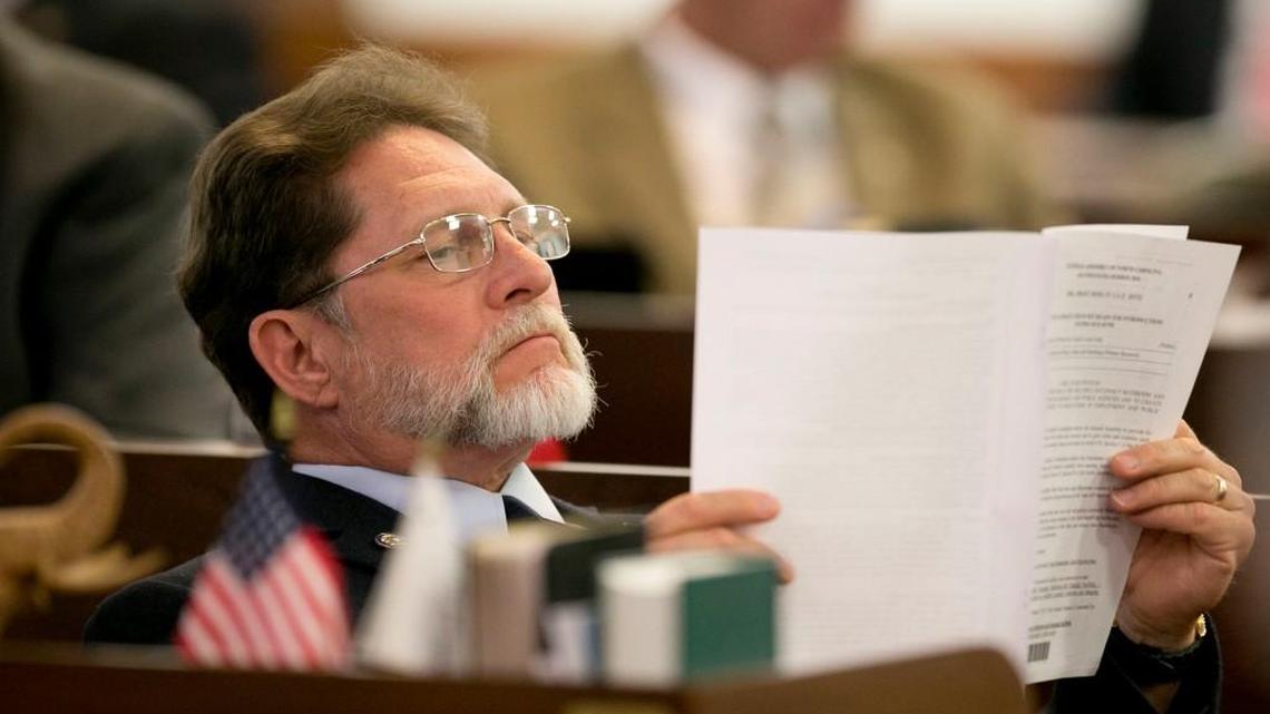 Rep. Larry Pittman of Concord, NC, reads legislation during a debate on March 23, 2016, at the General Assembly in Raleigh.  Pittman said Thursday, May 31, 2018, that he has been apologizing to Democrats for the way his fellow Republicans have shut them out of the budget process, although he said he still planned to vote for their budget because he liked a lot of what it contained.