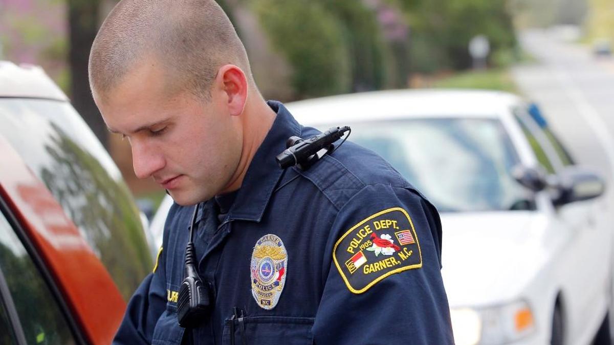 A body camera on his shoulder records Garner police officer Kevin Murray's interaction with a motorist as he makes a traffic stop on his patrol in Garner on April 8, 2015.