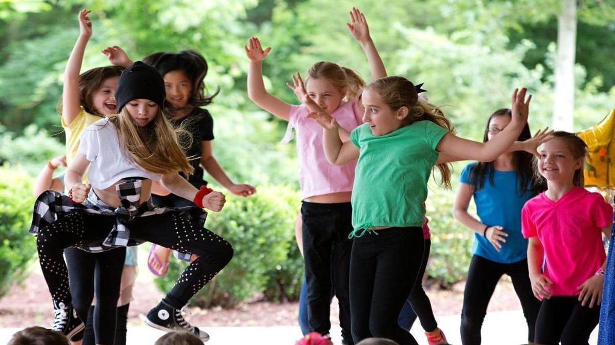 Madison Britt, 9, front left, and Kinsey Hill, 9, front wearing green, lead a group dance during The Quest Academy Charter School's end of year showcase Thursday, June 2, 2016 in Raleigh, N.C. The State Board of Education gave approval Thursday, July 7, 2016, for 11 new charter schools to open in August 2016.