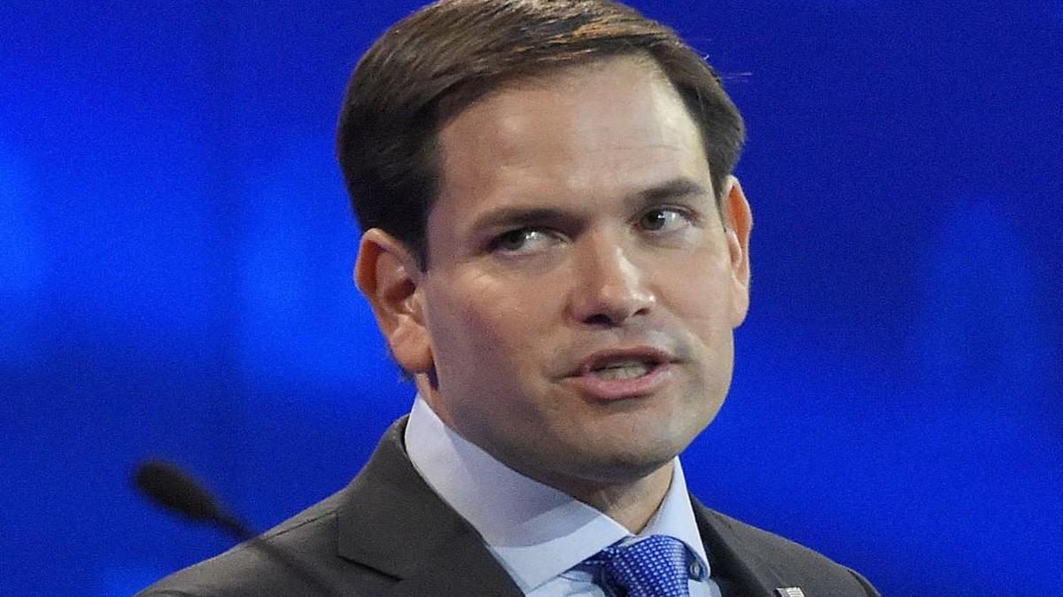 Marco Rubio, center, and Jeb Bush, left, argue a point as Donald Trump, looks on during the CNBC Republican presidential debate at the University of Colorado, Wednesday, Oct. 28, 2015, in Boulder, Colo.