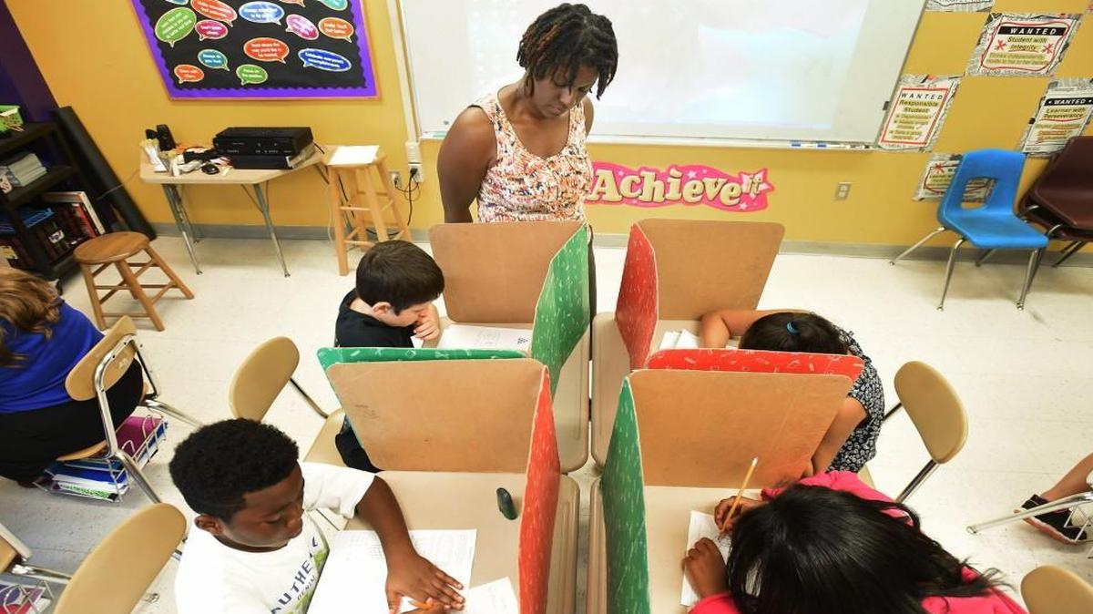 Fifth grade teacher Tawauna Stewart, 50, monitors an exam on math and volumes at Pearsontown Elementary School in Durham, N.C. Wednesday, August 12, 2015.