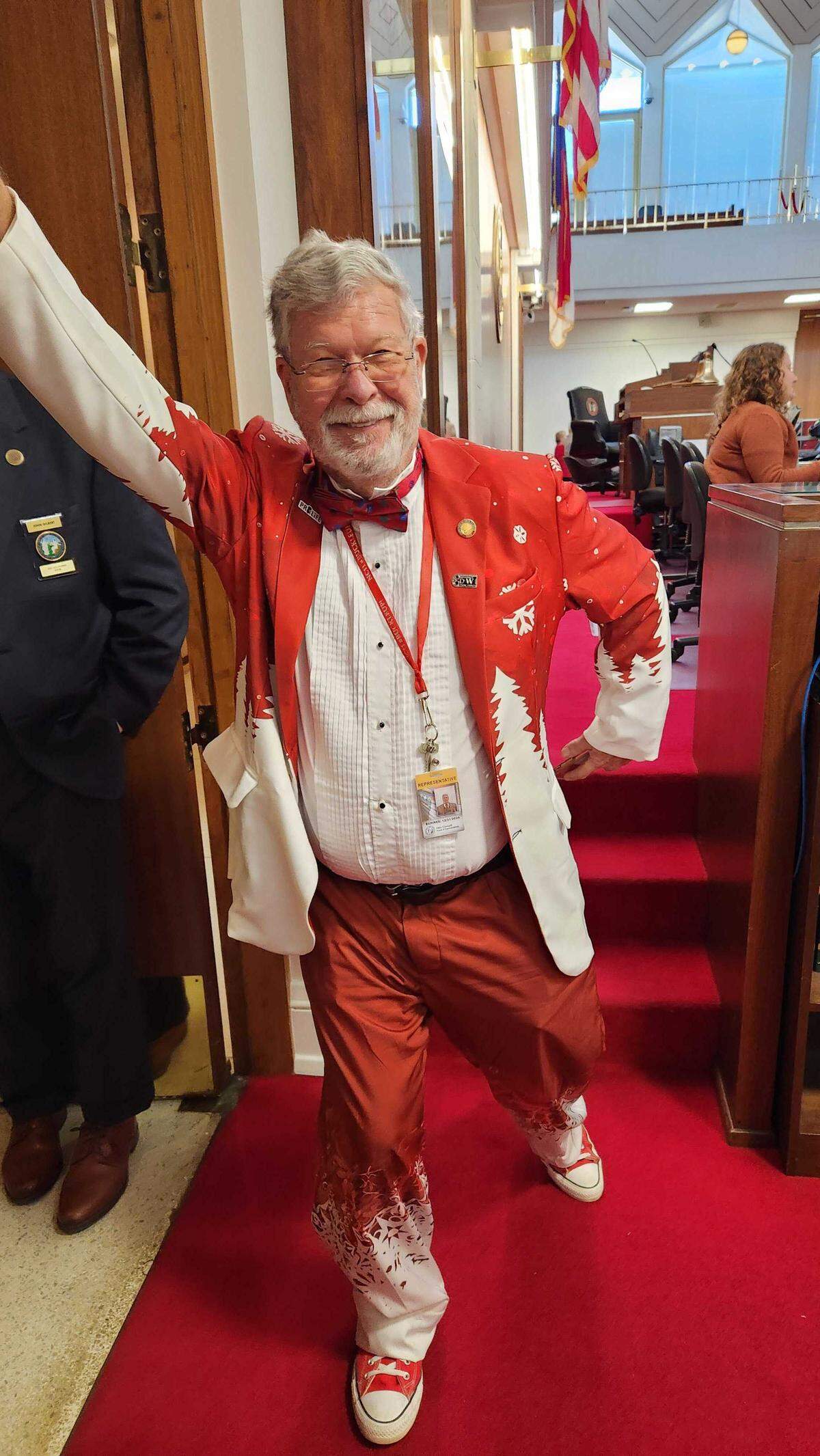 Republican Rep. Mike Clampitt poses for a photo to show off his festive Christmas suit after a House session on Dec. 20, 2023 at the Legislative Building in Raleigh, N.C.