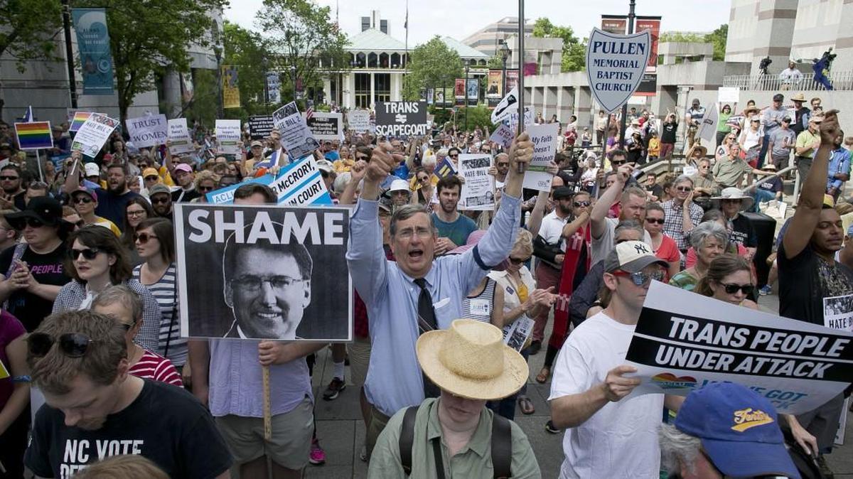 John Chase of Durham, center, follows the chants of North Carolina NAACP President Rev. William Barber during a rally in opposition of House Bill 2 in Raleigh in April.