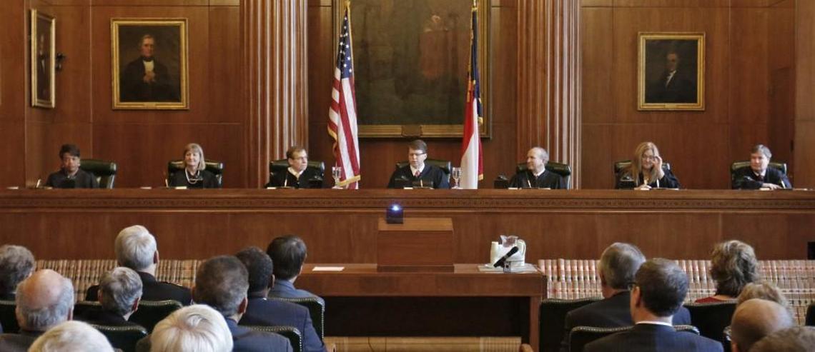 The justices on the Supreme Court of North Carolina, pictured on Jan. 5, 2015, from left to right were Cheri Beasley, Robin Hudson,  Robert Edmunds, Jr., Chief Justice Mark Martin, Paul Newby, Barbara Jackson and Sam Ervin IV.
