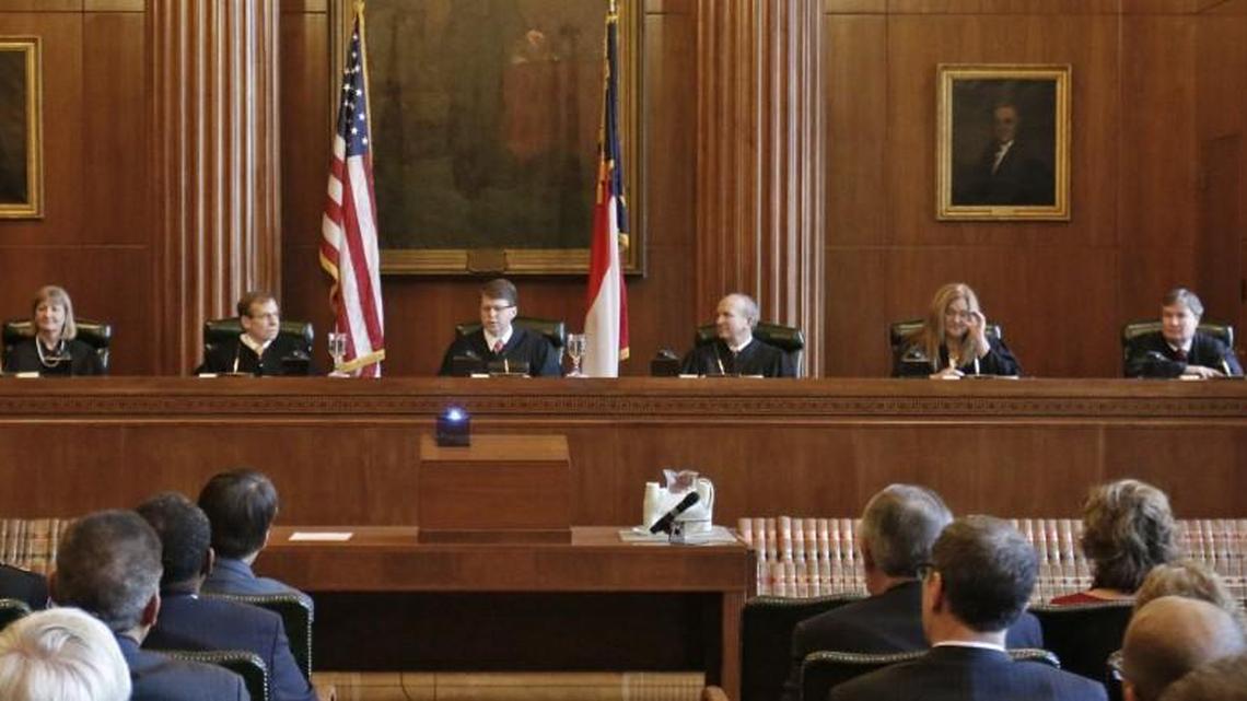 The justices on the Supreme Court of North Carolina, pictured on Jan. 5, 2015, from left to right were Cheri Beasley, Robin Hudson, Robert Edmunds, Jr., Chief Justice Mark Martin, Paul Newby, Barbara Jackson and Sam Ervin IV.