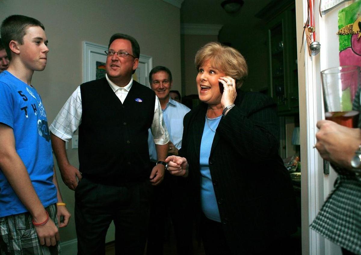 Deborah Prickett, second from right, reacts to hearing that she has won a seat on the Wake County school board in this 2009 file photo. Pictured on the left are Prickett’s son Grayson, her husband, David Prickett, and Mike Swanson, back center.