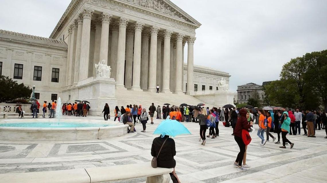 People wait in line to enter the US Supreme Court, on April 19, 2017 in Washington, DC.